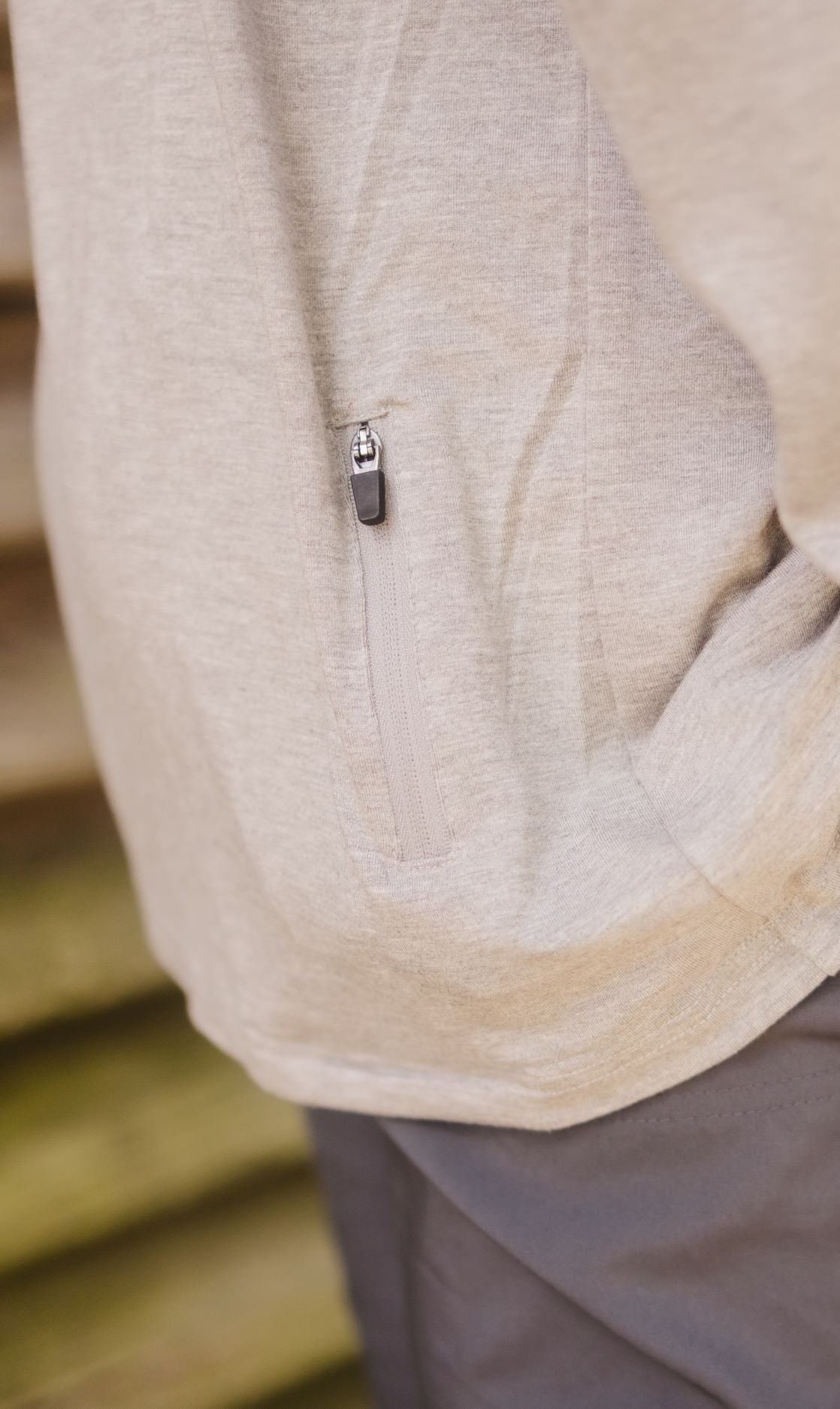 Back zipper of the Classic Midweight Bamboo Hoodie in Heather Grey.