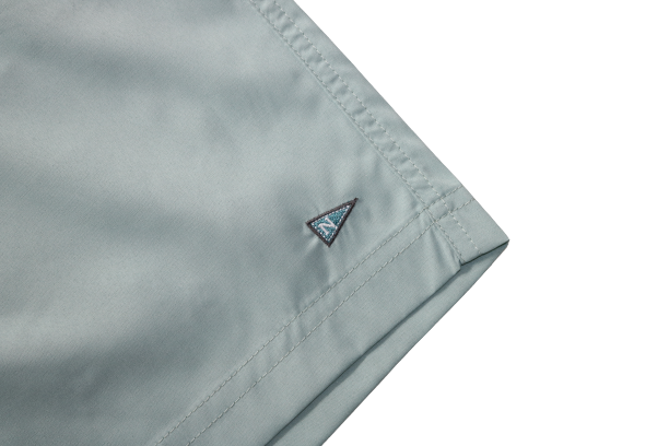 Side logo of the Bamboo Lined Sabalo Fishing Shorts. These fishing shorts are perfect for long days on the water.
