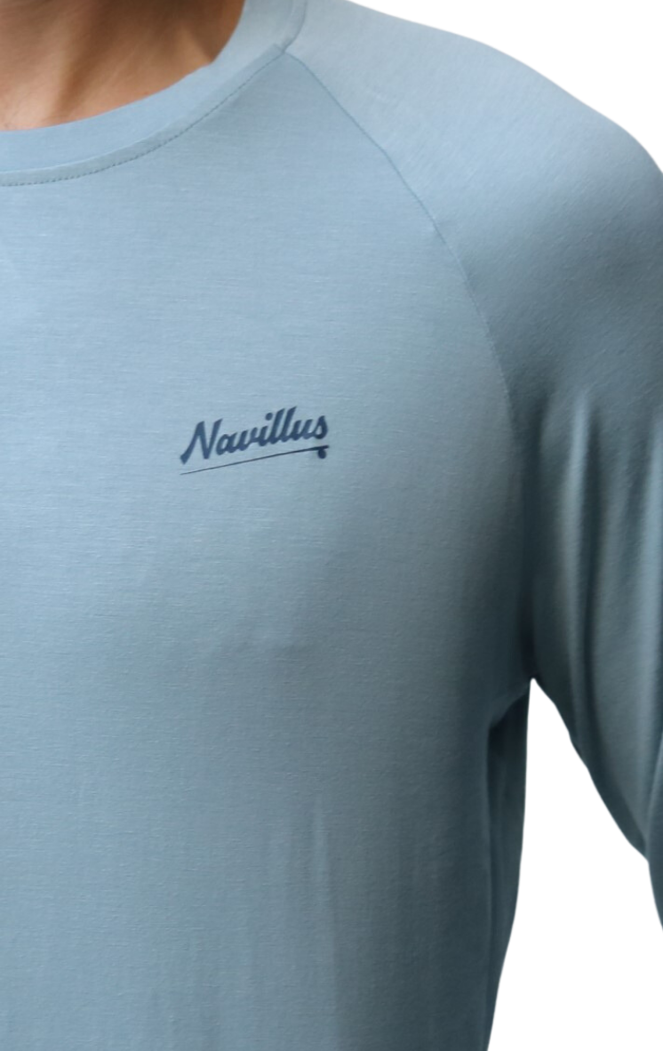 Front logo of the Classic Fly Lightweight Long Sleeve Shirt in Light Ocean Blue.