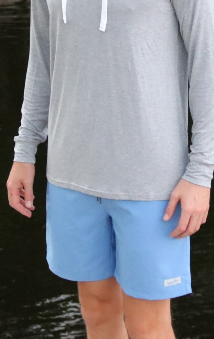 The model is wearing the Blue Wave Bamboo Lined Classic Shorts. These shorts are perfect for a long day on the water. 