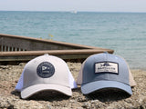Picture with the Classic Logo Snapback fishing cap and Deep Sea Snapback. These fishing trucker caps have a mesh back.