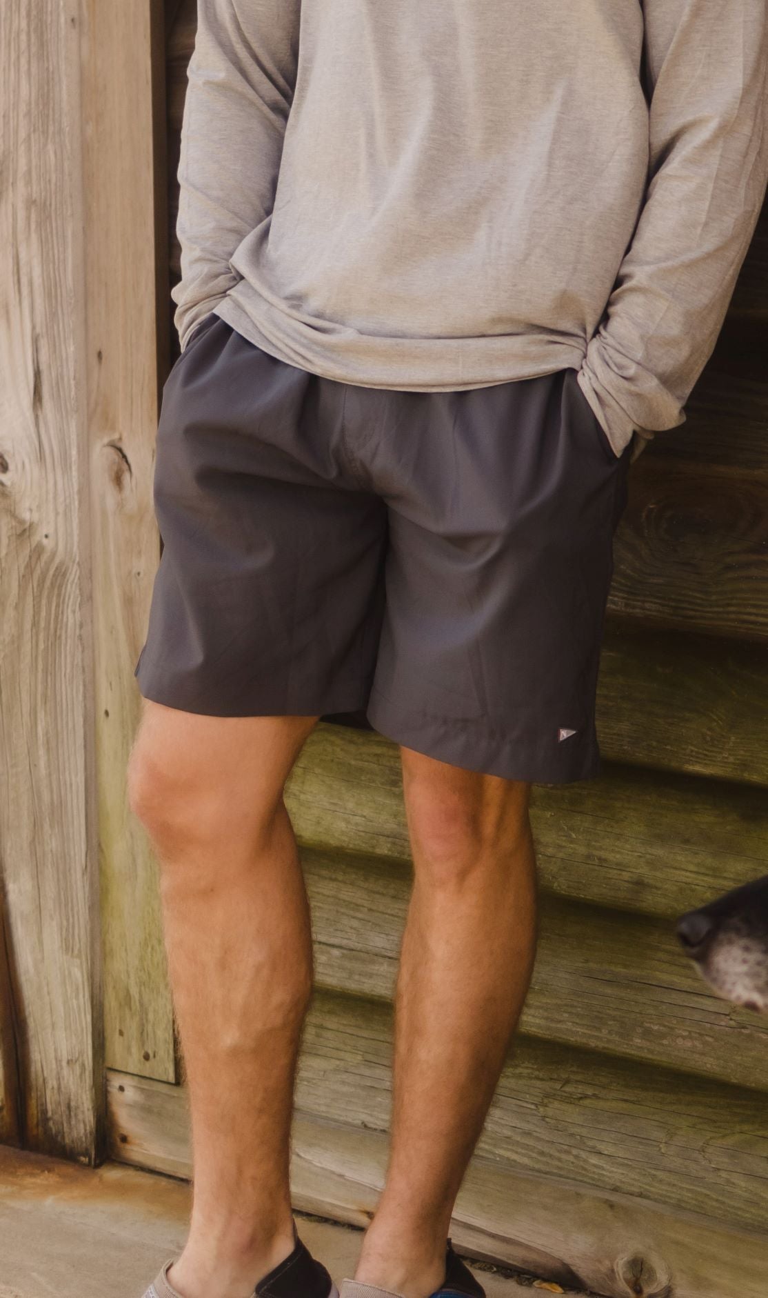 Model wearing the Sabalo fishing shorts in Dark Grey.