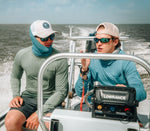 Model wearing the Bamboo Neck Gaiter in Ocean Blue. This fishing buff provides 35+ UPF sun protection.