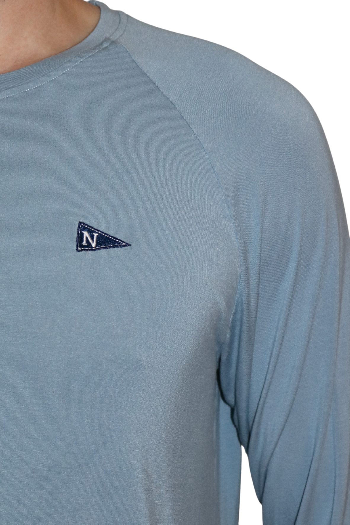 Front logo of the Icon Bamboo Long Sleeve Shirt in Light Ocean Blue.