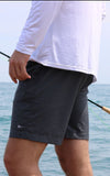 Model wearing the Bamboo Lined Sabalo Fishing Shorts. These fishing shorts are perfect for long days on the water.
