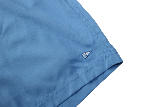 Front logo of the Bamboo Lined Sabalo Fishing Shorts. These fishing shorts are perfect for long days on the water.