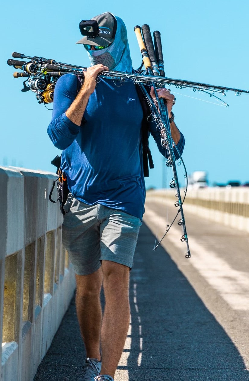 Fisherman wearing the Icon lightweight bamboo long sleeve shirt in Navy.