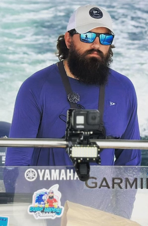Fisherman wearing the Icon lightweight bamboo long sleeve shirt in Navy.