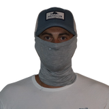 Model wearing the Bamboo Neck Gaiter in Heather Grey. This fishing buff provides 35+ UPF sun protection.