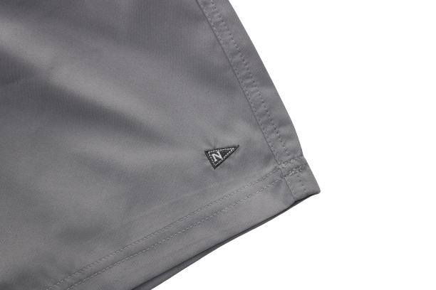 Front logo of the Bamboo Lined Sabalo Fishing Shorts. These fishing shorts are perfect for long days on the water.